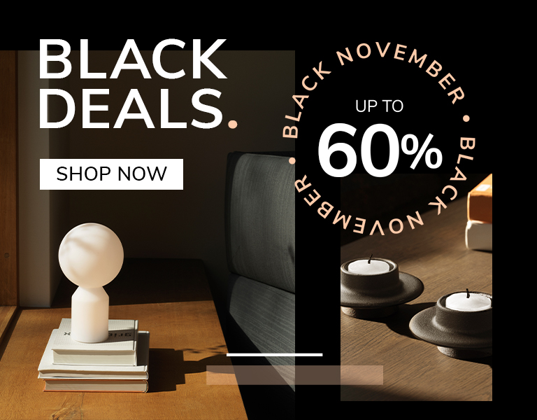 Discover More Elegant designer table lamp on natural stone base with gold stem and white shade, promoting Black November sale – up to 40% off with text ‘First Black Deals’ and ‘Discover More’ button.